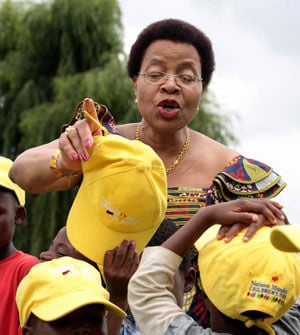Nelson Mandela's wife, Graca Machel, hands out caps to children from a children's home during the launch of the Champions for Children campaign in Kempton Park in December 2009. (Werner Beukes, Sapa)