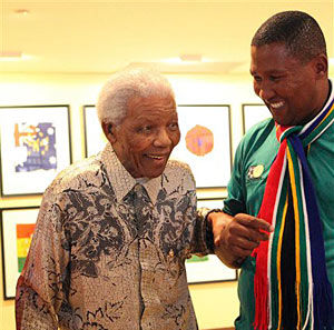 The photo, provided by Nelson Mandela Foundation, shows former South African president Nelson Mandela (left) as he is shown an exhibition by his grandson, Chief Nkosi Zwelivelile Mandela (right) in Johannesburg on Tuesday. (AP/Nelson Mandela Foundation)
