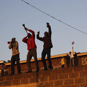 Fans celebrate in Tembisa on Friday. (Ricardo Mazalan, AP)