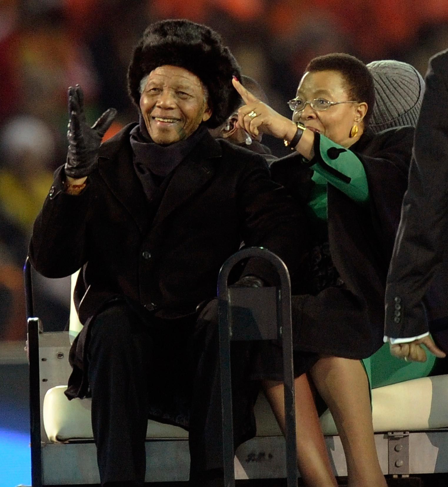 Nelson Mandela and his wife, Graca Machel, are seen ahead of the Soccer World Cup final at Soccer City in Johannesburg on Sunday. (Martin Meissner, AP)