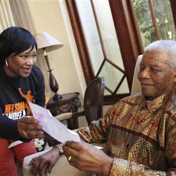 Former South African president Nelson Mandela is pictured with his youngest daughter Zindzi at his home in Johannesburg on Saturday. (Debbie Yazbek, Nelson Mandela  Foundation)