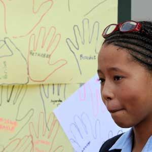 A child shows messages she and her classmates made for Nelson Mandela at a school near Milpark Hospital in Johannesburg on January 27 2011. (Sapa)