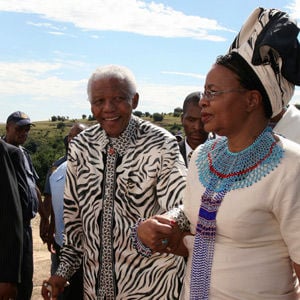 Former South African President Nelson Mandela and his wife Graça Machel arrive for a ceremony where his grandson Mandla Mandela was installed as chief of the Mvezo Traditional Council on April 16 2007. (Antony Kaminju, Reuters)