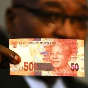 President Jacob Zuma shows off the new R50 banknote, which bears a portrait of Madiba. (Reuters)