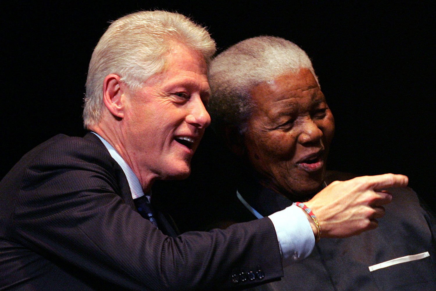 Nelson Mandela listens to former US president Bill Clinton during the third Nelson Mandela Annual Lecture on July 19, 2005 in Johannesburg. (Alexander Joe, AFP)