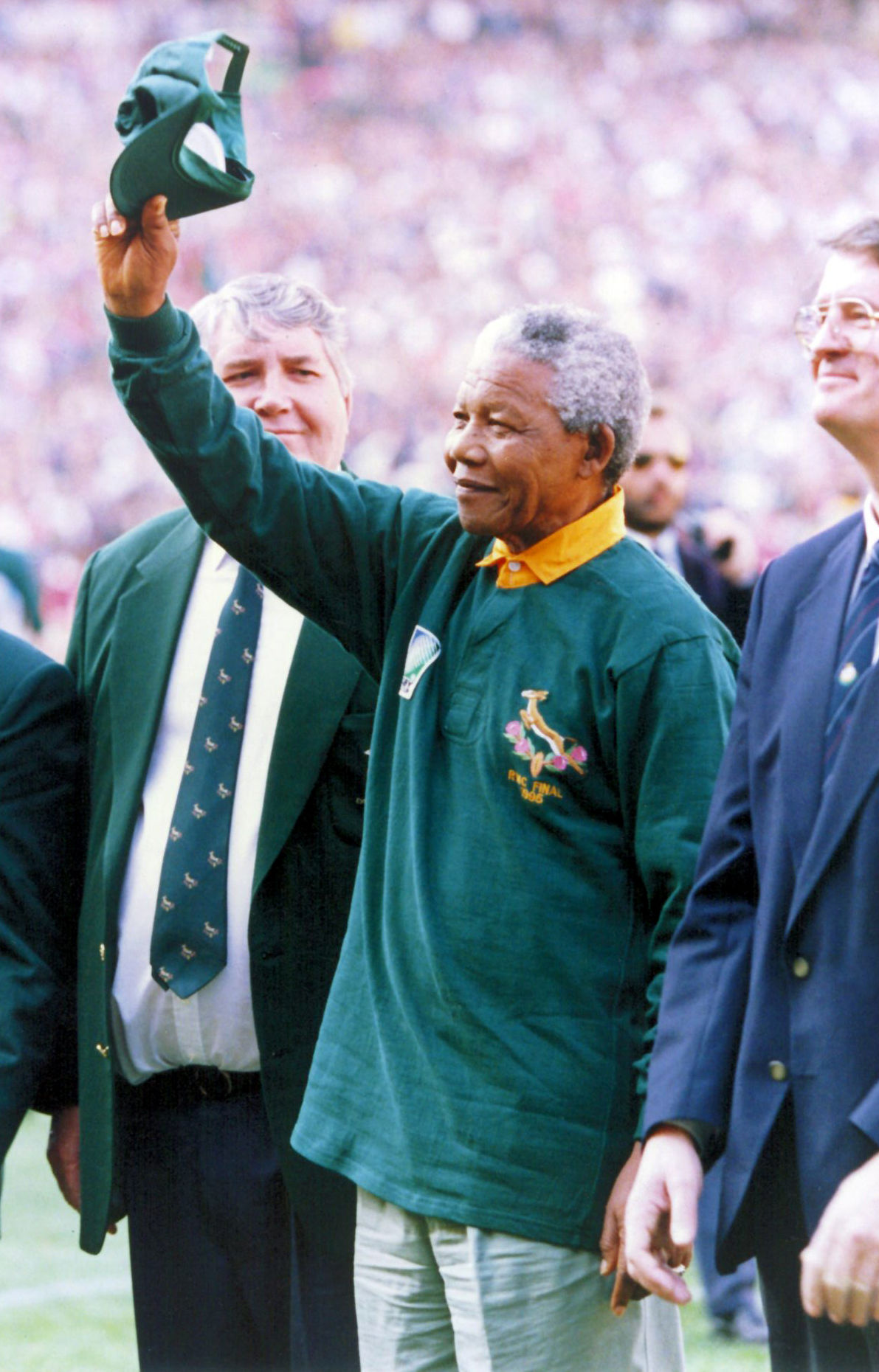 Then South African president Nelson Mandela, dressed in a number 6 Springbok jersey, celebrates after South Africa beat the All Blacks by 15-12 to win the 1995 Rugby World Cup on June 24 1995.