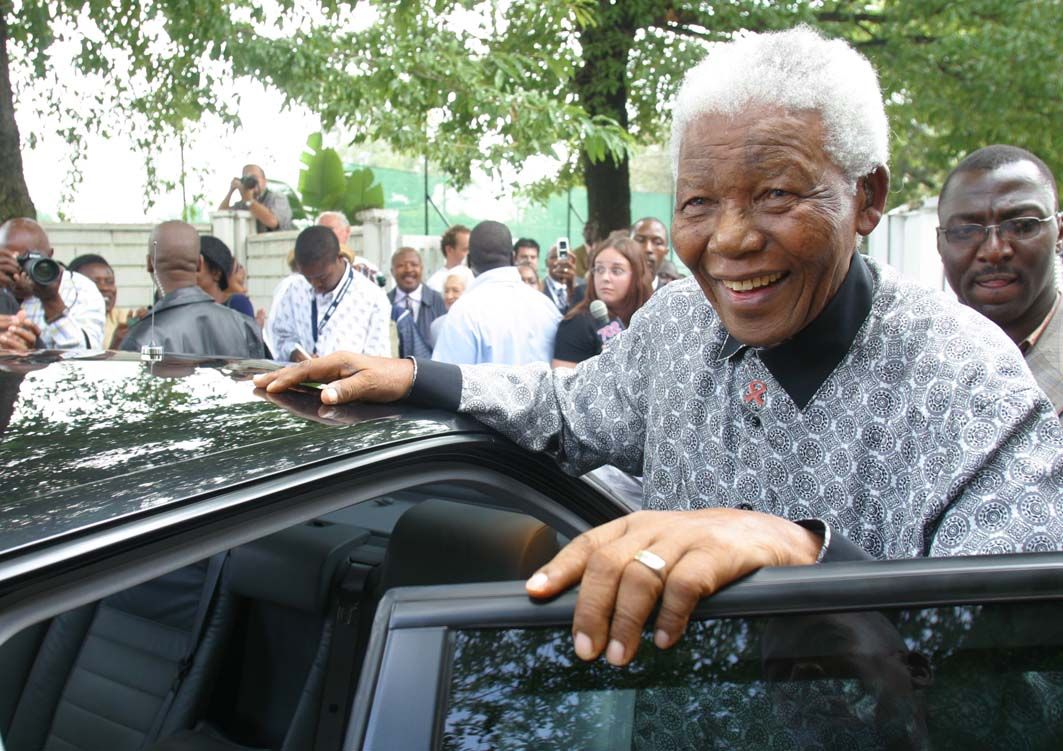 Former South African President Nelson Mandela smiles after casting his vote in the municipal elections in Johannesburg March 1 2006.