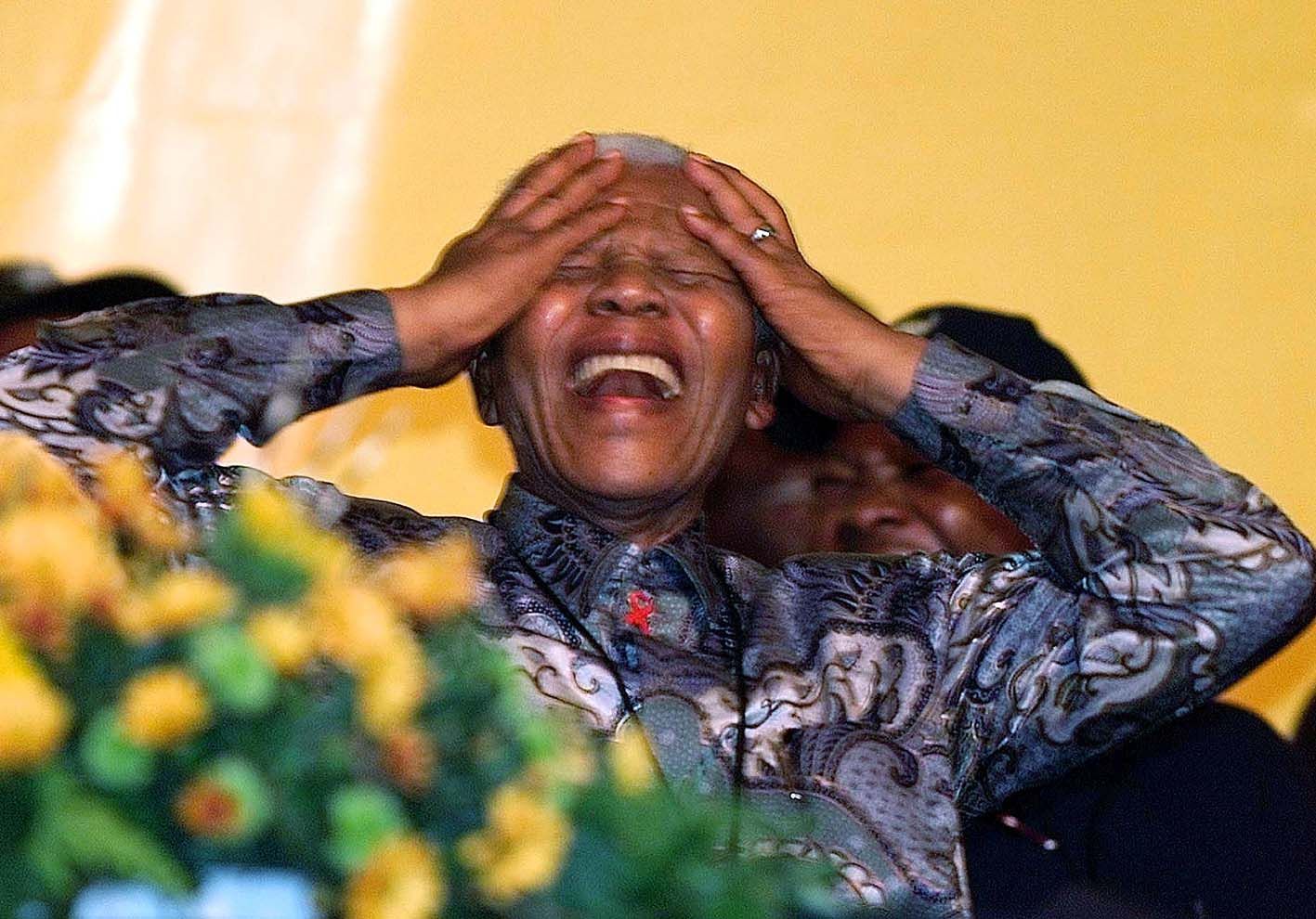 Nelson Mandela is overwhelmed by the vote of thanks made by the African National Congress (ANC) after his speech to delegates at the ANC's convention in Cape Town on December 17 2002.