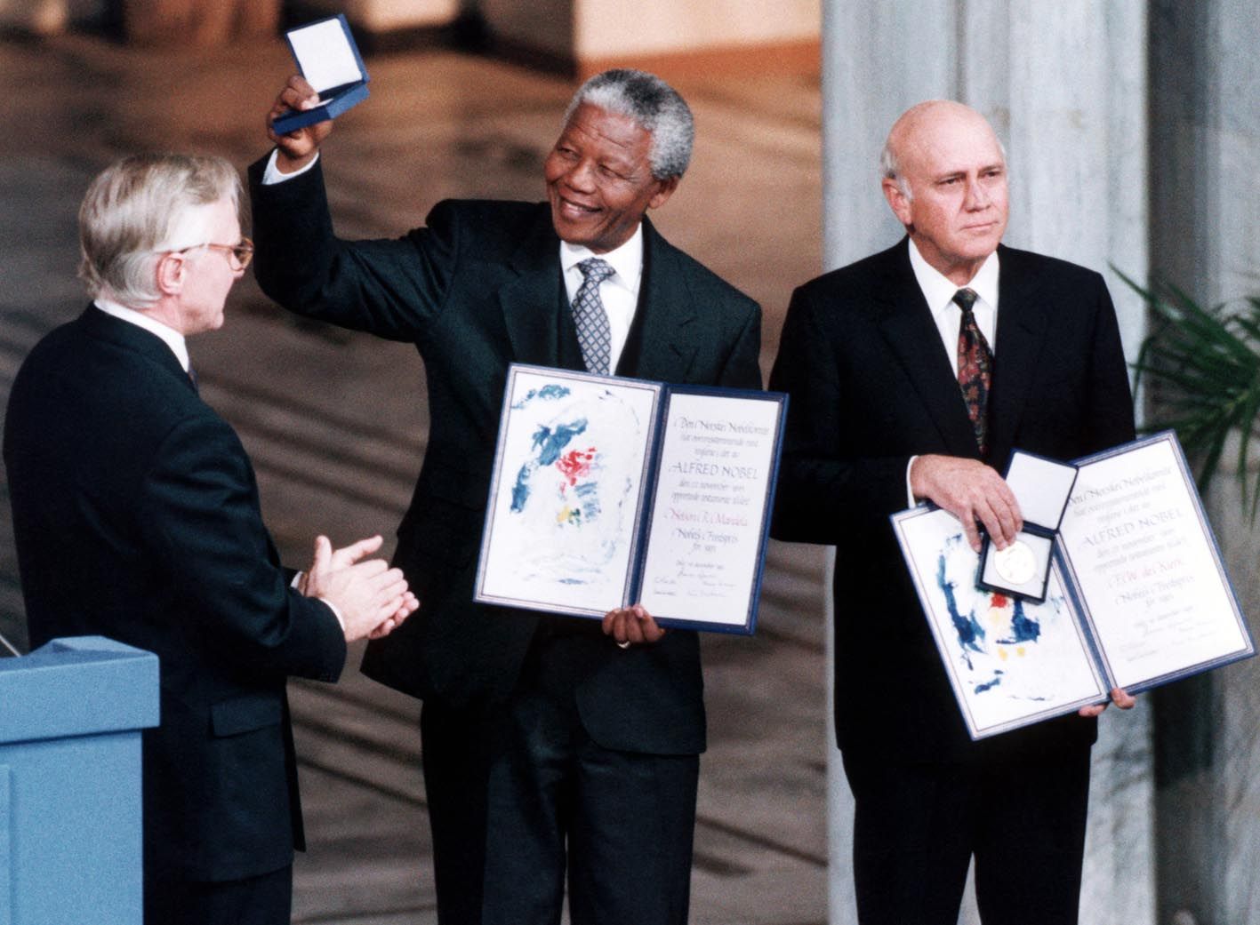 African National Congress leader Nelson Mandela holds up the medal and certificate after he was jointly awarded the 1993 Nobel Peace Prize with South African President FW de Klerk  in Oslo.