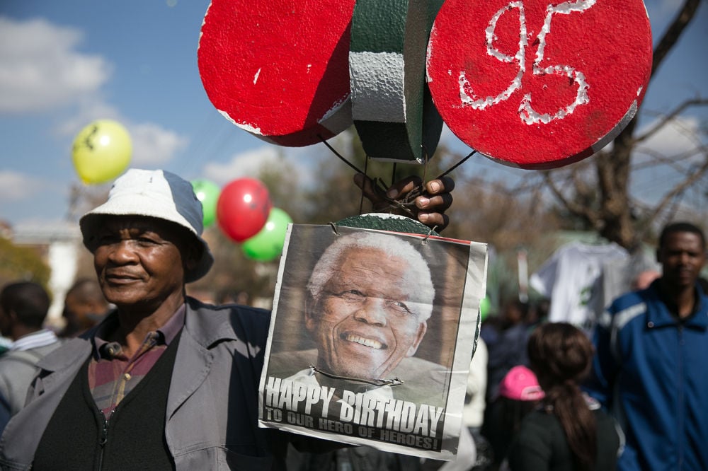 SA celebrates improvement in Mandela's health on his birthday