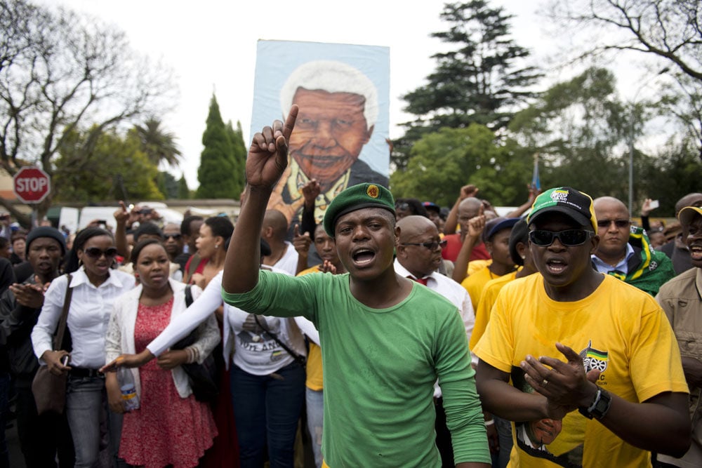 Well-wishers outside Nelson Mandela's Houghton home in Johannesburg on Friday, December 6 2013. (Delwyn Verasamy, M&G)